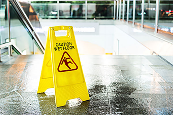 Wet floor sign to avoid negligence 