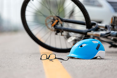 helmet and glasses next to bike
