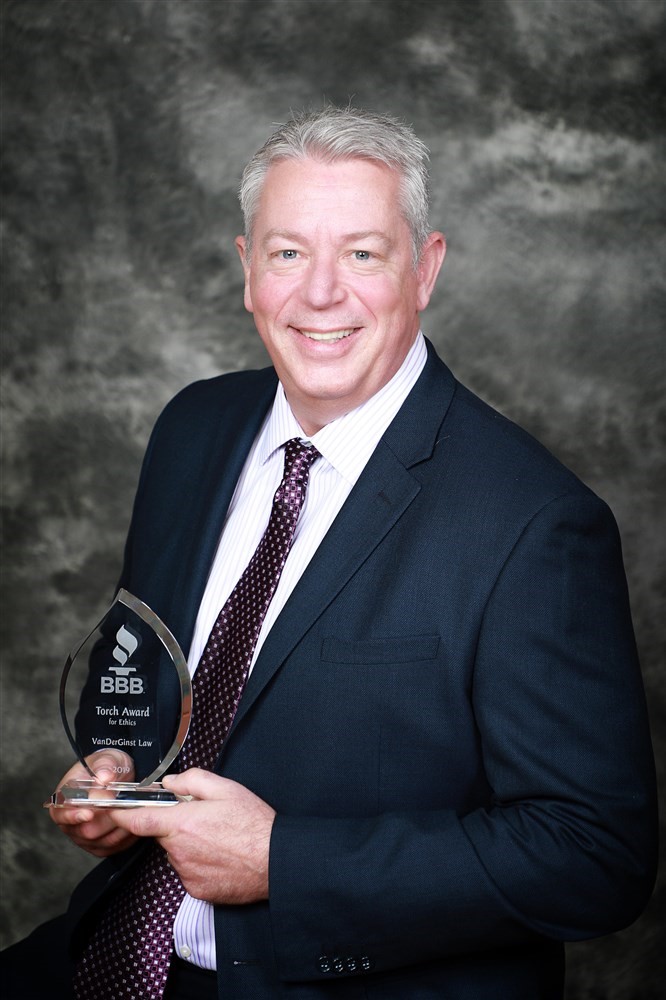 Dennis VanDerGinst With BBB Torch Award