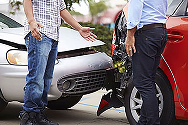 car accident with two men talking to each other beside it