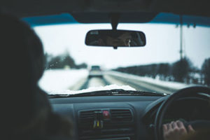 interior of vehicle with snow visible on windshield