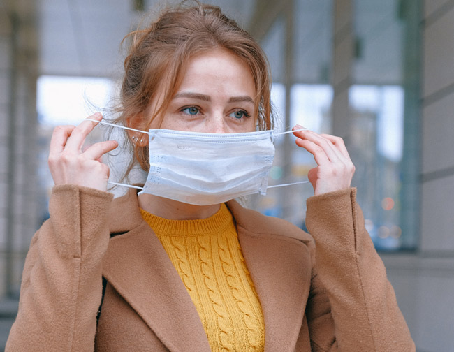 Workplace Coronavirus - Lady Wearing a Face Mask at Work