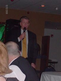 Dennis VanDerGinst addresses the crowd at the first VanDerGinst Holiday Bash