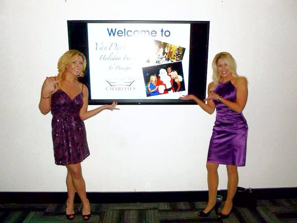 Maggie Hand and Nancy Swanson modeling the welcome monitor