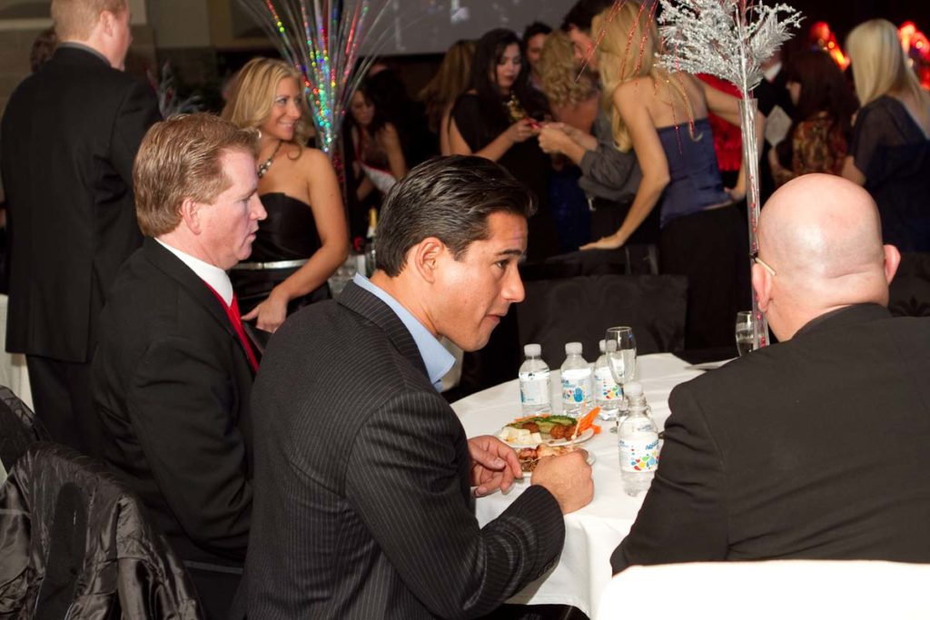 Mario Lopez enjoying food and conversation