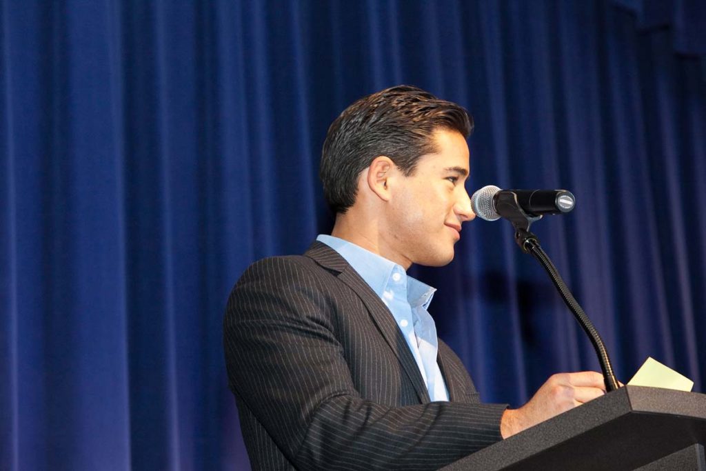 Mario Lopez making announcements at VanDerGinst Holiday Bash